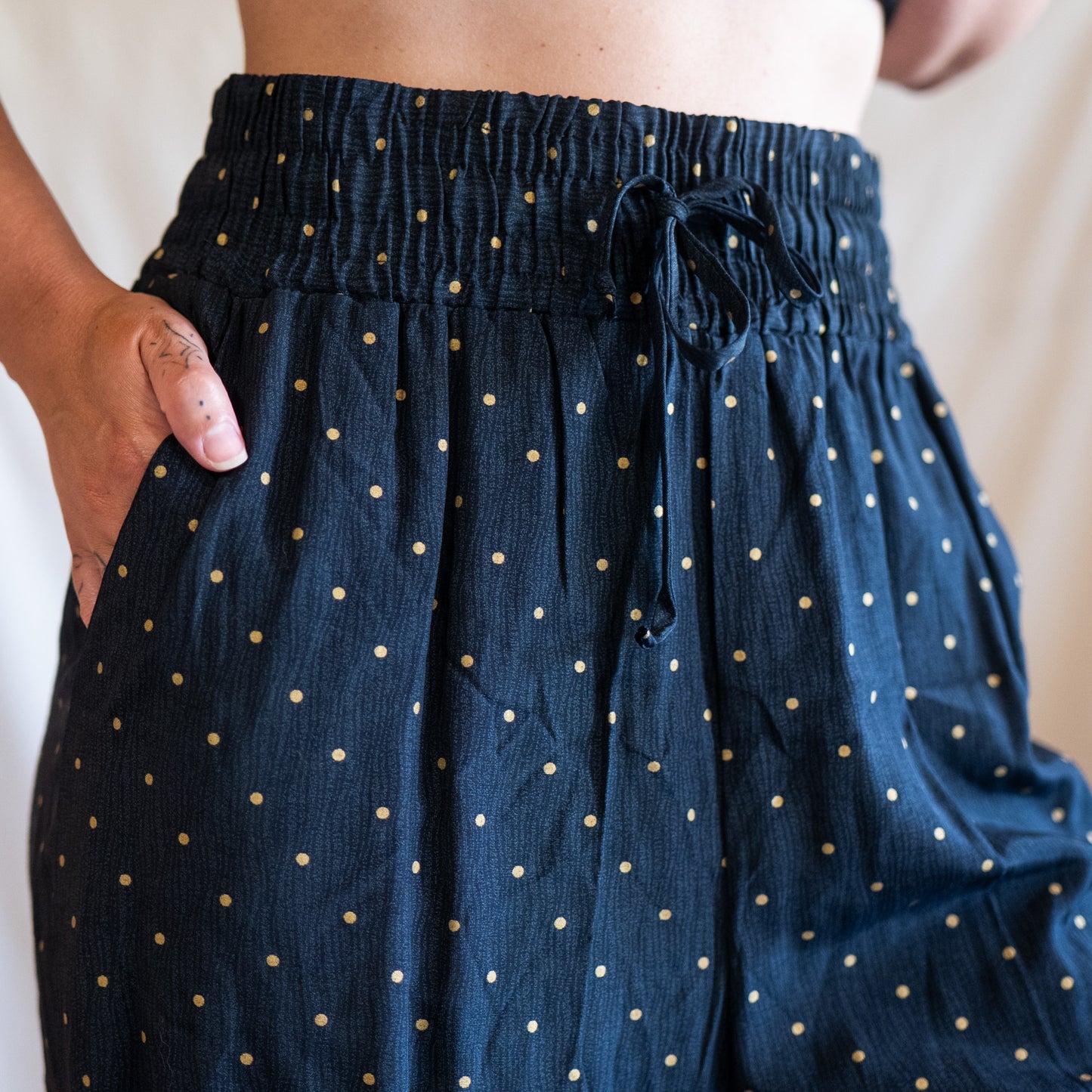 vintage 80s deadstock black & gold polka dot wide leg pants